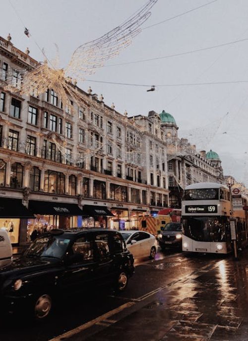 pexels-photo-1661569-1661569 View of bustling Regent Street with Christmas decorations and busy traffic in London.